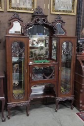 ETEGERE. Ornately carved and m