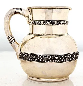 1 TIFFANY SILVER SHELL AND SCROLL PITCHER