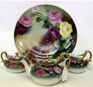 LIMOGES FRANCE PORCELAIN CHARGER with a hand painted rose decoration signed