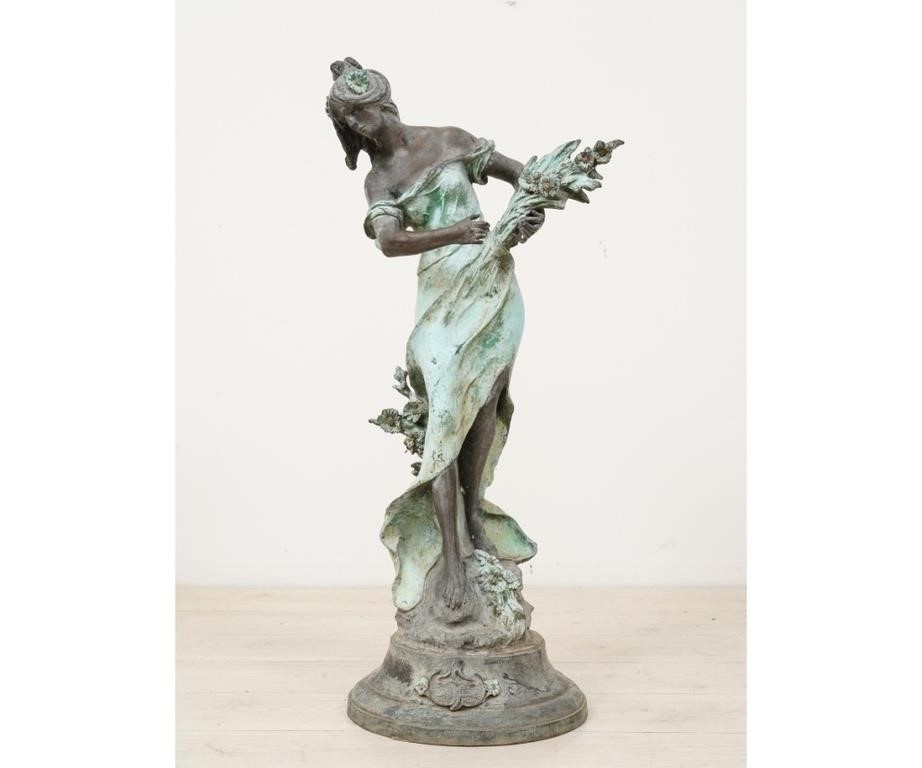 Faux bronze metal statue of a