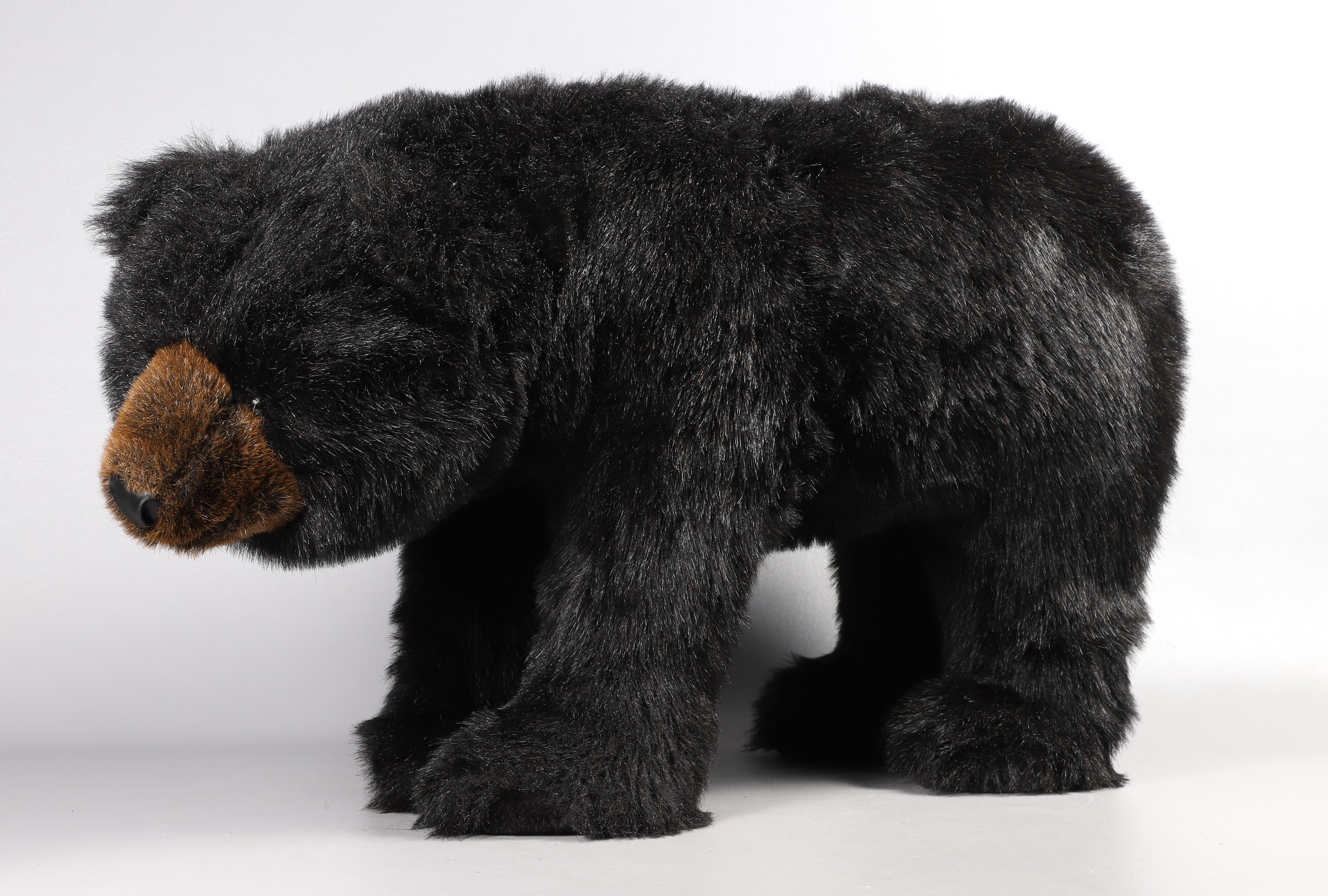 Faux fur black bear footrest,