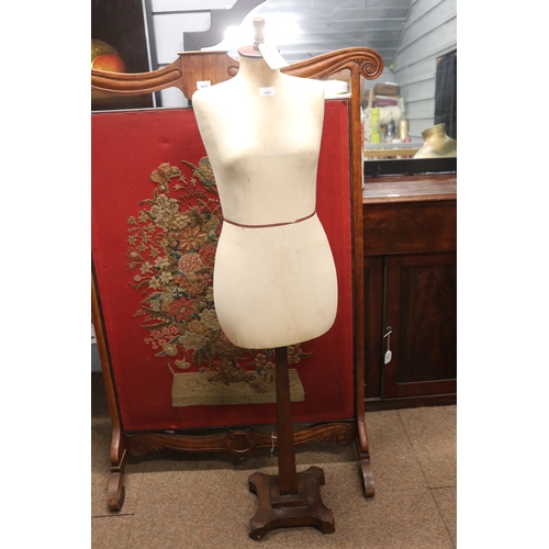 Female mannequin on square wooden