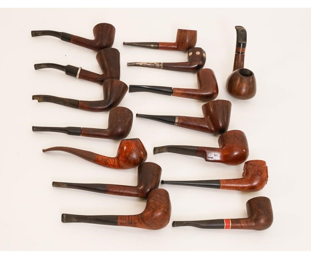Fifteen smoking pipes of various