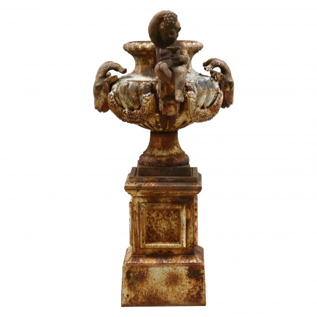 FIGURAL CAST IRON GARDEN URN ON