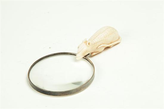 FIGURAL MAGNIFYING GLASS.  American