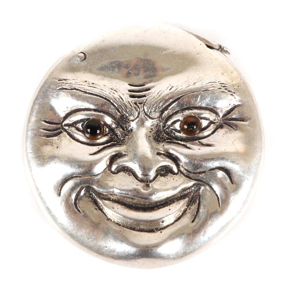 FIGURAL SILVER MAN IN THE FULL MOON