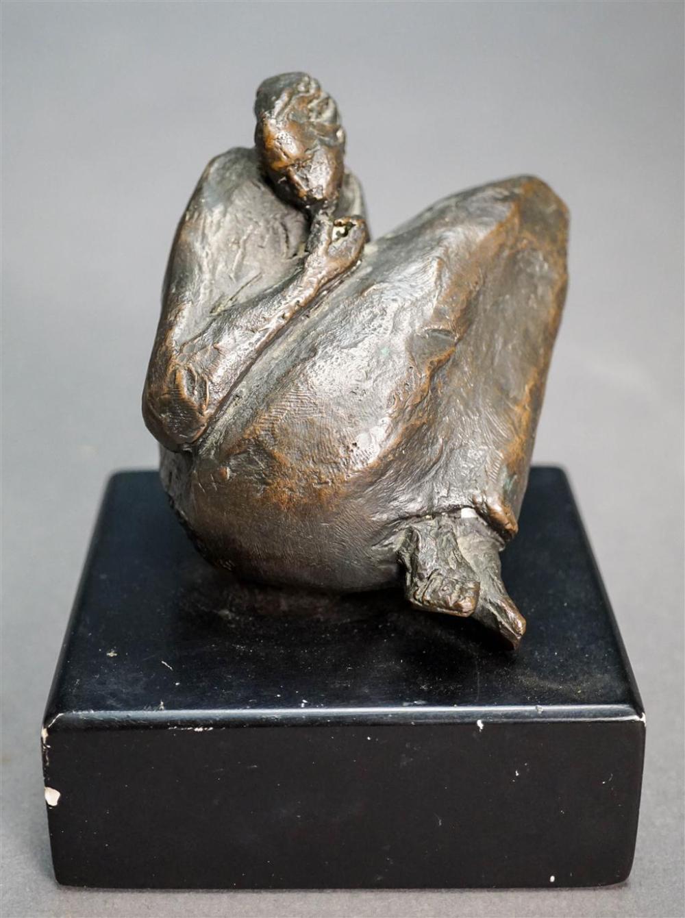 FIGURE OF A SEATED FEMALE, BRONZE