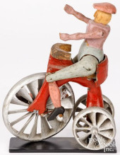 FIGURE RIDING A HIGH WHEEL BIC
