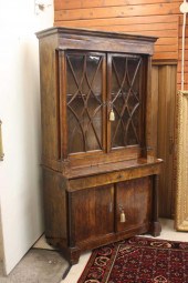 FIGURED MAHOGANY CABINET ON CA