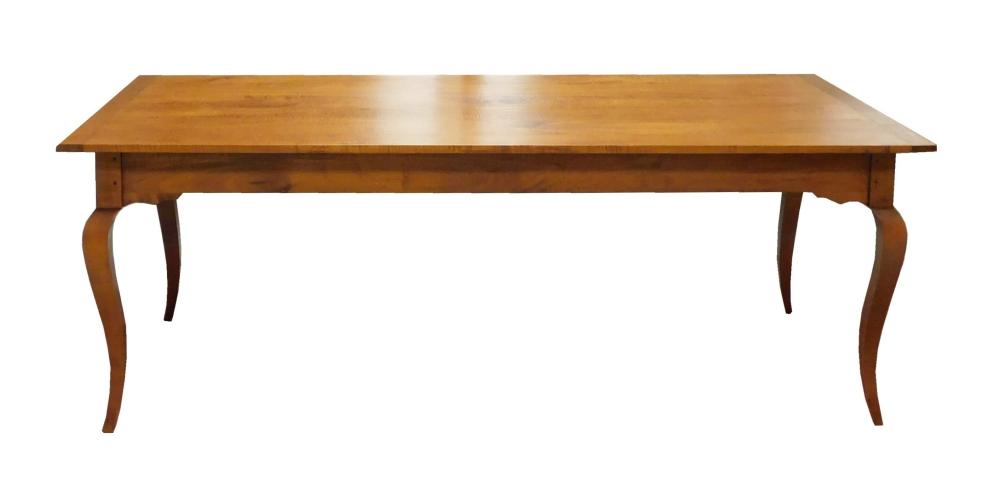 FIGURED MAPLE DINING TABLE BY