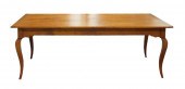 FIGURED MAPLE DINING TABLE BY