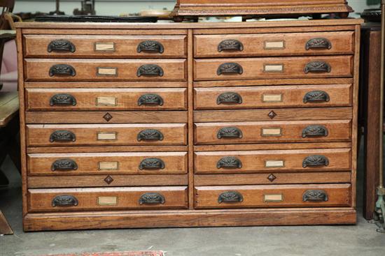FILE CABINET. Oak having twelve