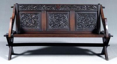 Fine carved oak trestle form bench,