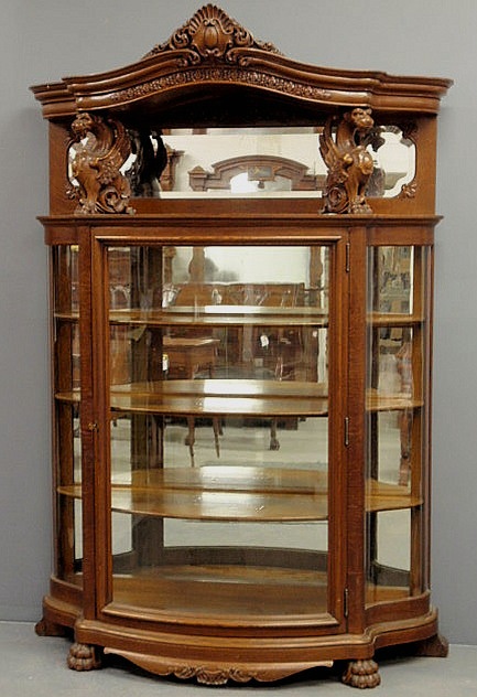 Fine oak bow-front china cabinet