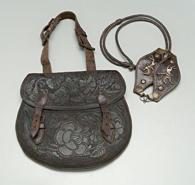 Finely tooled leather saddlebag,