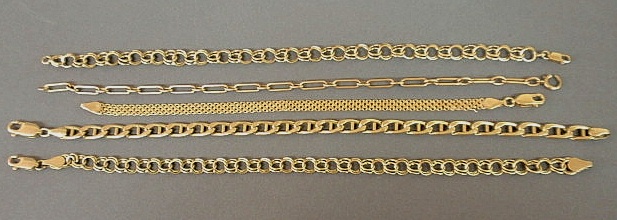 Five 14k yellow gold bracelets in