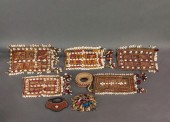 FIVE AFRICAN CLOTHS WITH COWRY