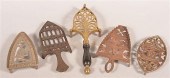 FIVE ANTIQUE IRON TRIVETS.Five