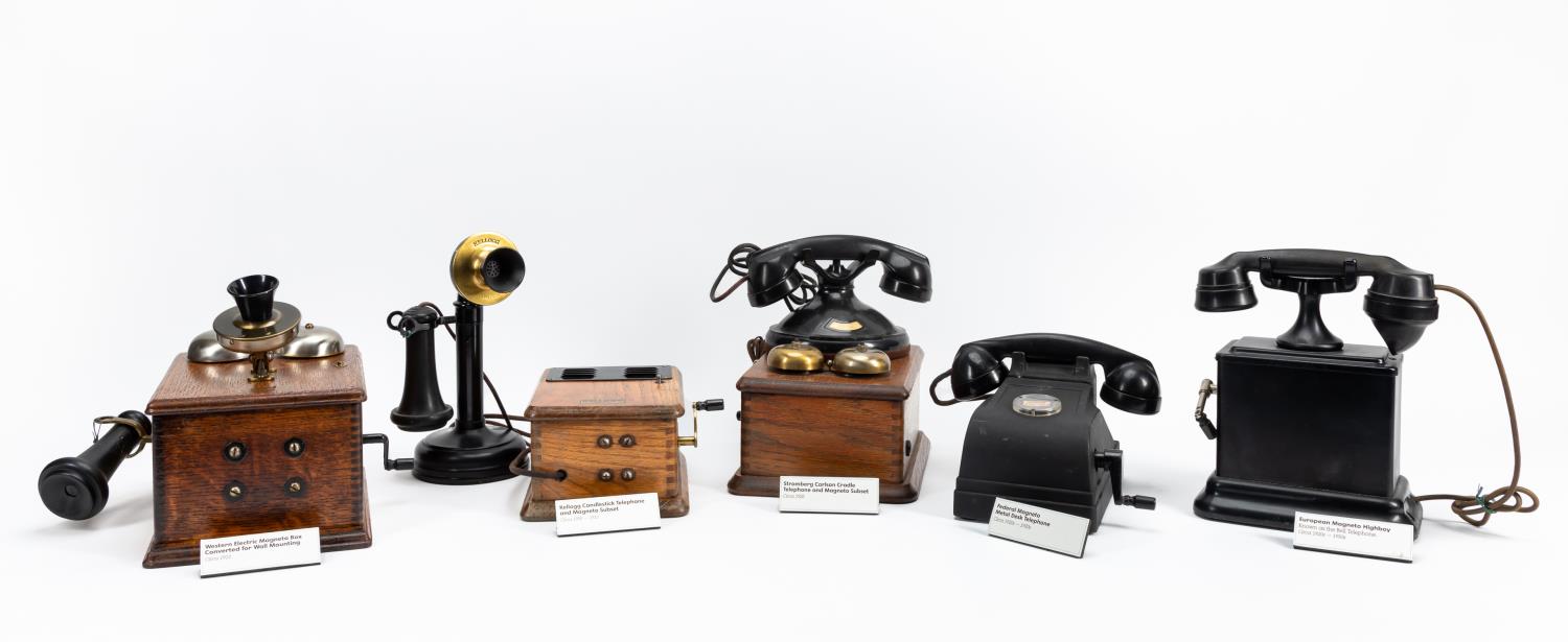 FIVE ANTIQUE TELEPHONES & PHONE