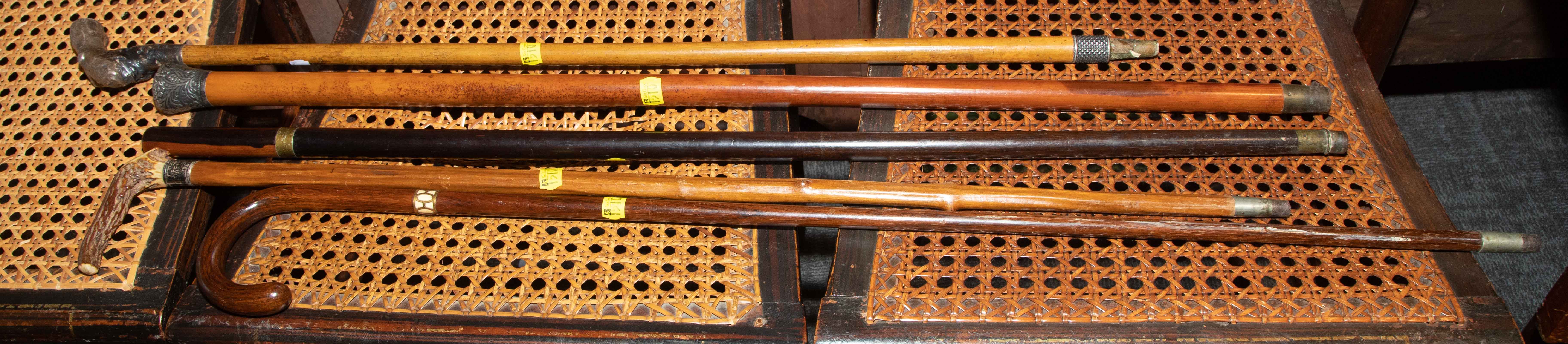 FIVE ASSORTED CANES & WALKING