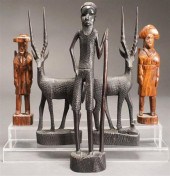 FIVE ASSORTED CARVED WOOD FIGU