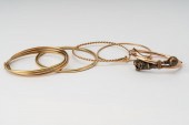 FIVE ASSORTED GOLD BANGLESIncl
