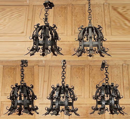 FIVE BLACK WROUGHT IRON CHANDELIERS
