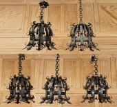 FIVE BLACK WROUGHT IRON CHANDE