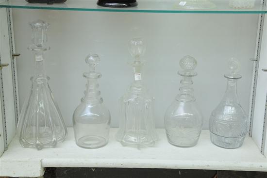 FIVE BLOWN GLASS DECANTERS. Clear