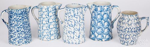 FIVE BLUE SPONGEWARE PITCHERS, 19TH