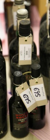 Five bottles including one vin