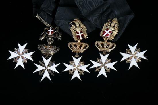 FIVE BRONZE AND WHITE ENAMEL MEDALS