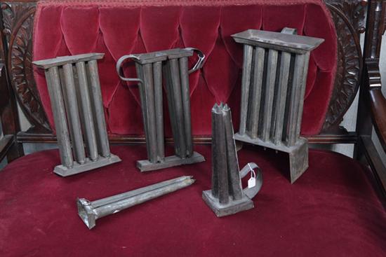 FIVE CANDLE MOLDS. Tin candle
