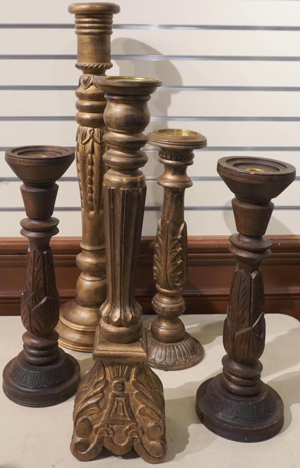 FIVE CARVED AND GILT WOOD CANDLE