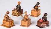 FIVE CARVED AND PAINTED KNOB A