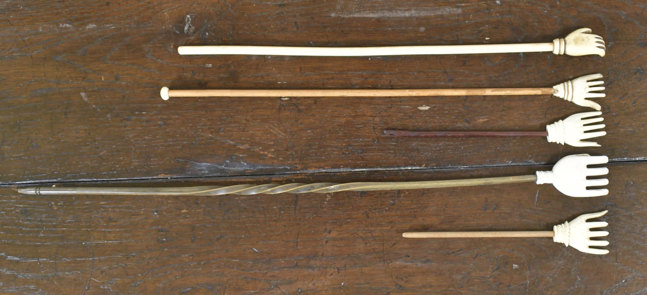 FIVE CARVED BACK SCRATCHERS, HAND