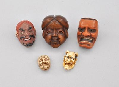 Five Carved Face Masks Two ivory