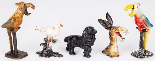 FIVE CAST IRON BOTTLE OPENERS,
