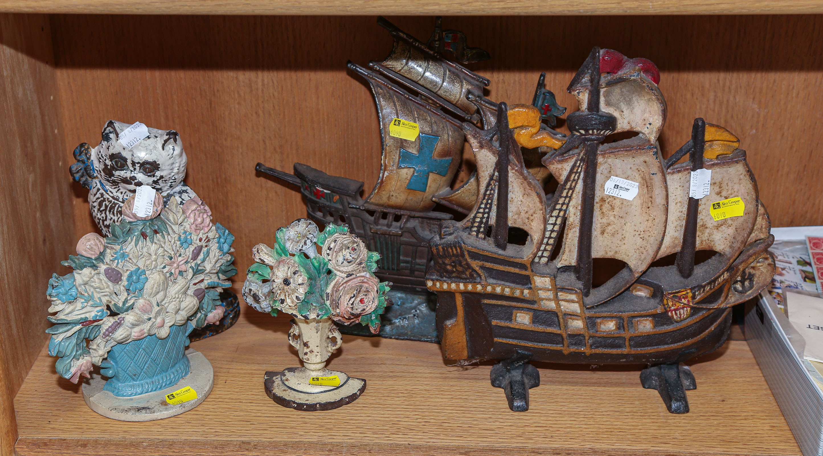 FIVE CAST IRON DOORSTOPS Comprising
