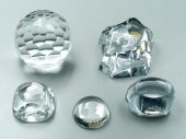 Five clear glass paperweights:
