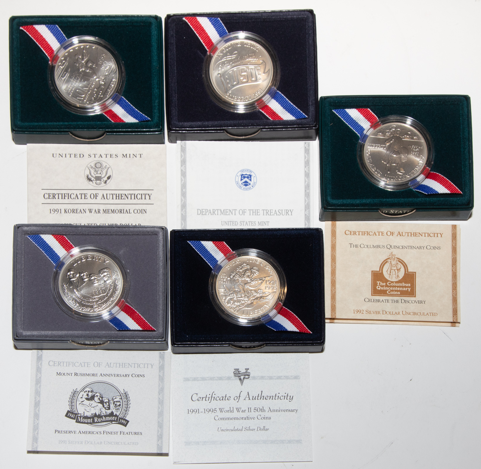 FIVE COMMEMORATIVE SILVER DOLLARS
