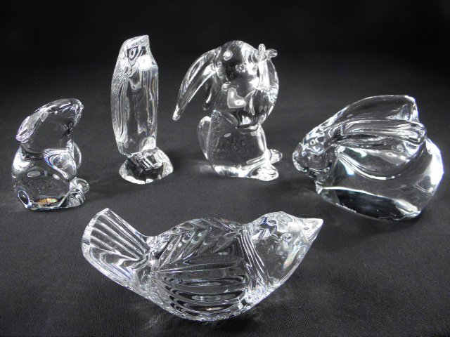 Five crystal animal figurines.