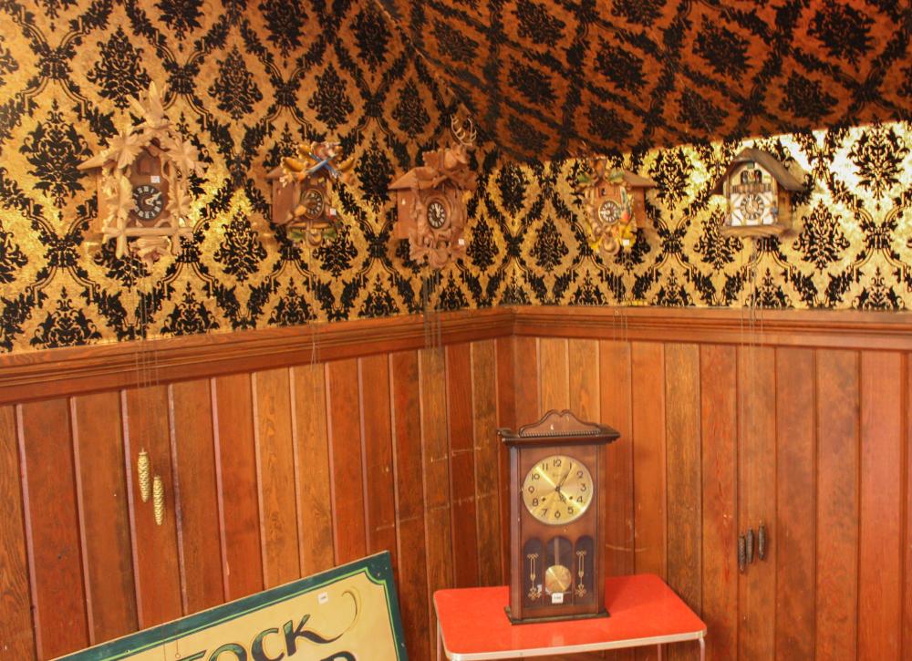 FIVE CUCKOO CLOCKS AND ONE WALL