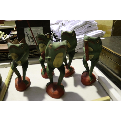 Five decorative painted wood frogs,
