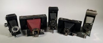 Five early folding bellows cameras,