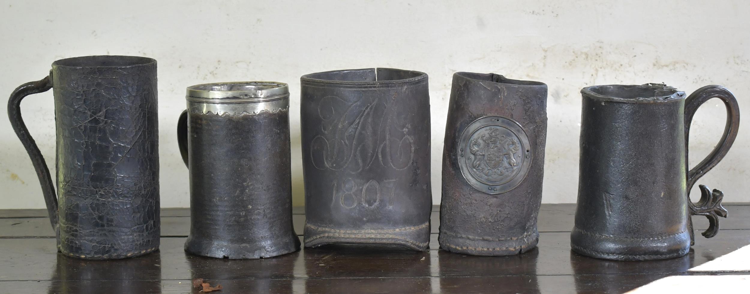 FIVE EARLY LEATHER MUGS/BLACKJACKS.