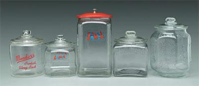Five glass advertising jars: