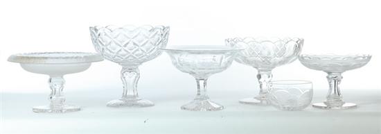 FIVE GLASS COMPOTES AND A FINGER