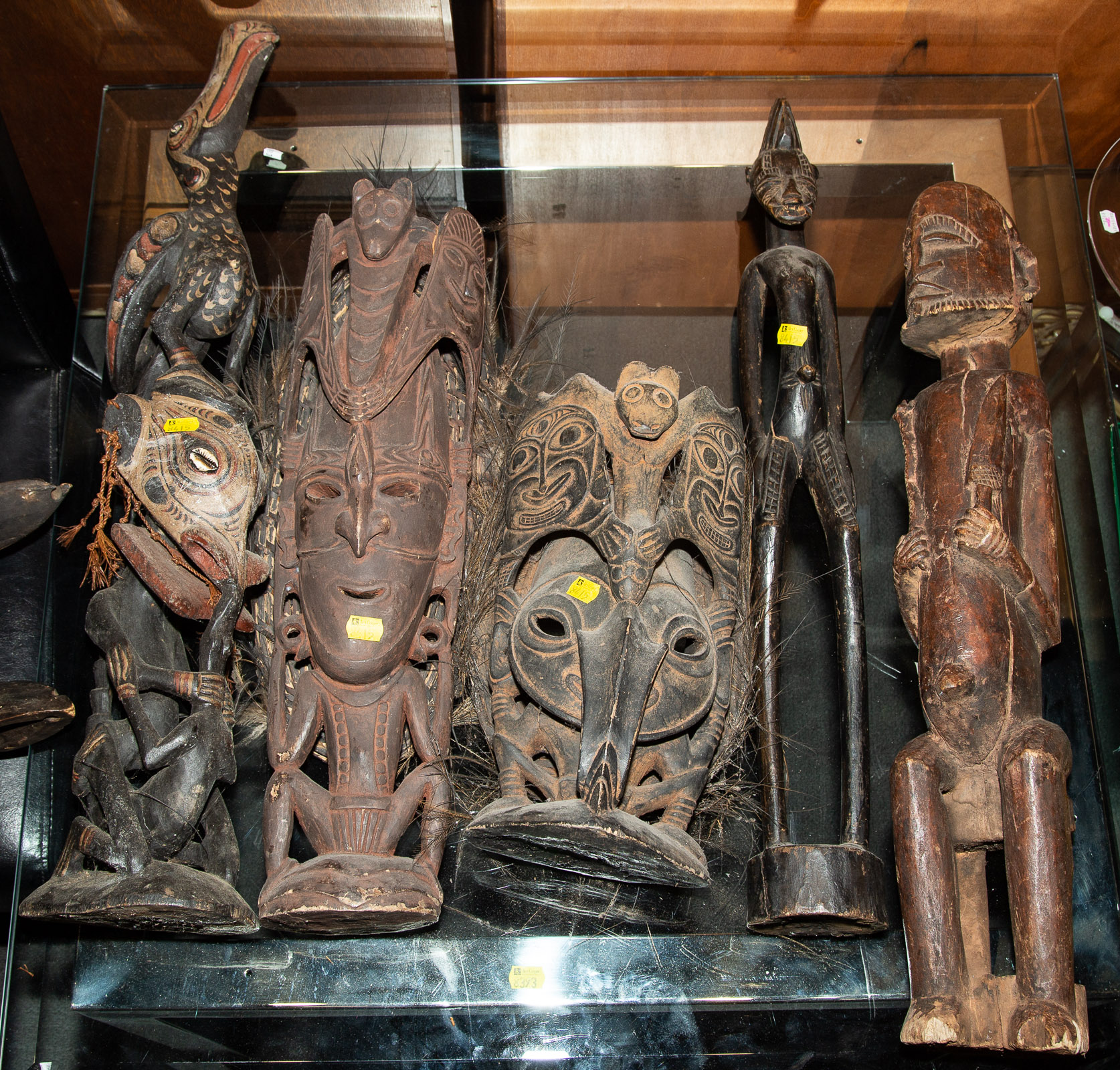 FIVE INDIGENOUS CARVED WOOD