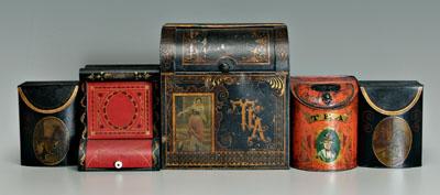 Five lidded tins: one marked